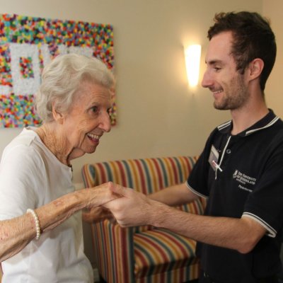 Daniel Innes with a resident ... "every morning the stereo went on and I was on my feet, being led around the make-shift dancefloor"